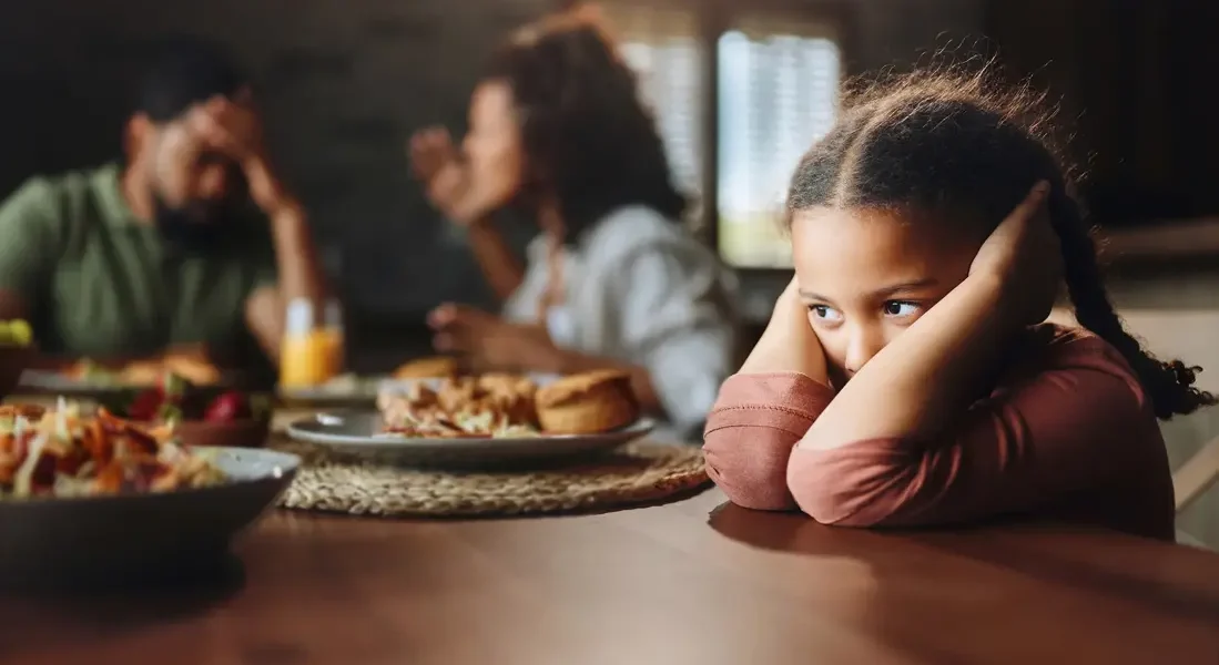 child-cowers-parents-argue