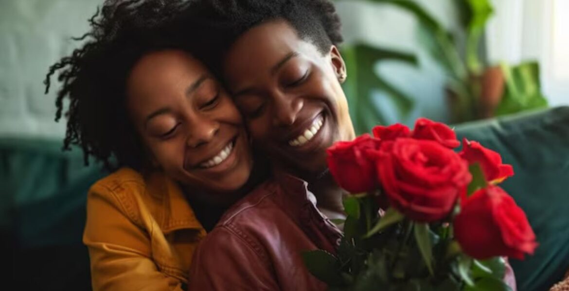 Joyful woman receiving a fresh bouquet of twelve red roses as a romantic surprise gift."